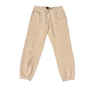 HM loose fit joggers men’s small cream color, elastic waist cotton blend.